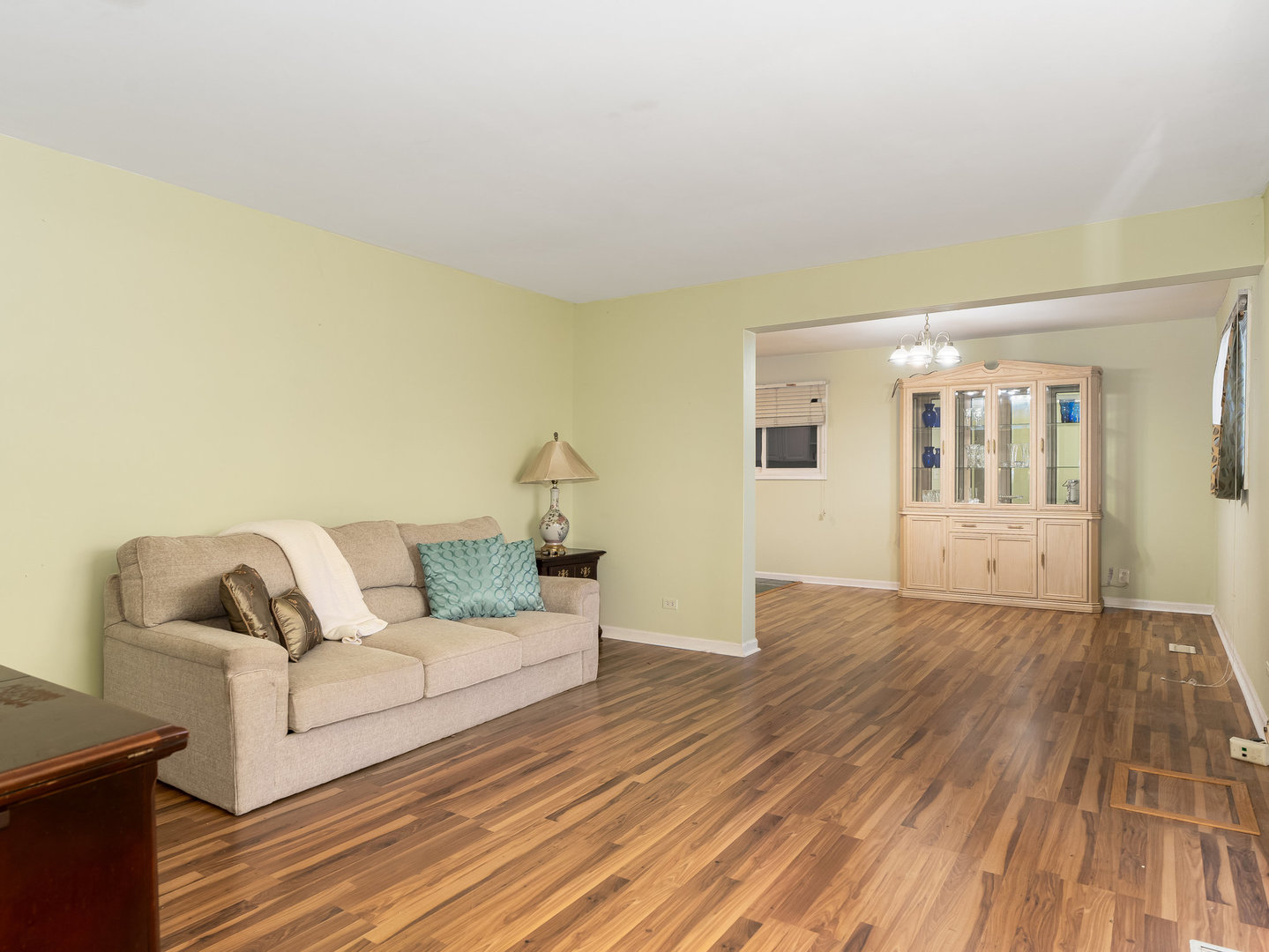 410 Aster Lane Hoffman Estates, IL 60169 - Photo 2 of 12 a living room with furniture and wooden floor