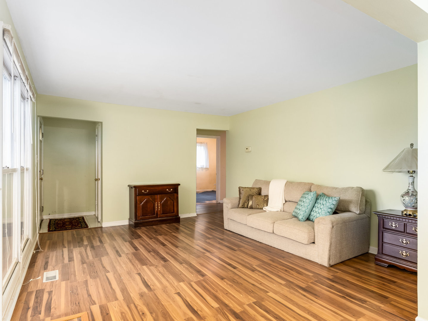 410 Aster Lane Hoffman Estates, IL 60169 - Photo 3 of 12 a living room with furniture and a wooden floor