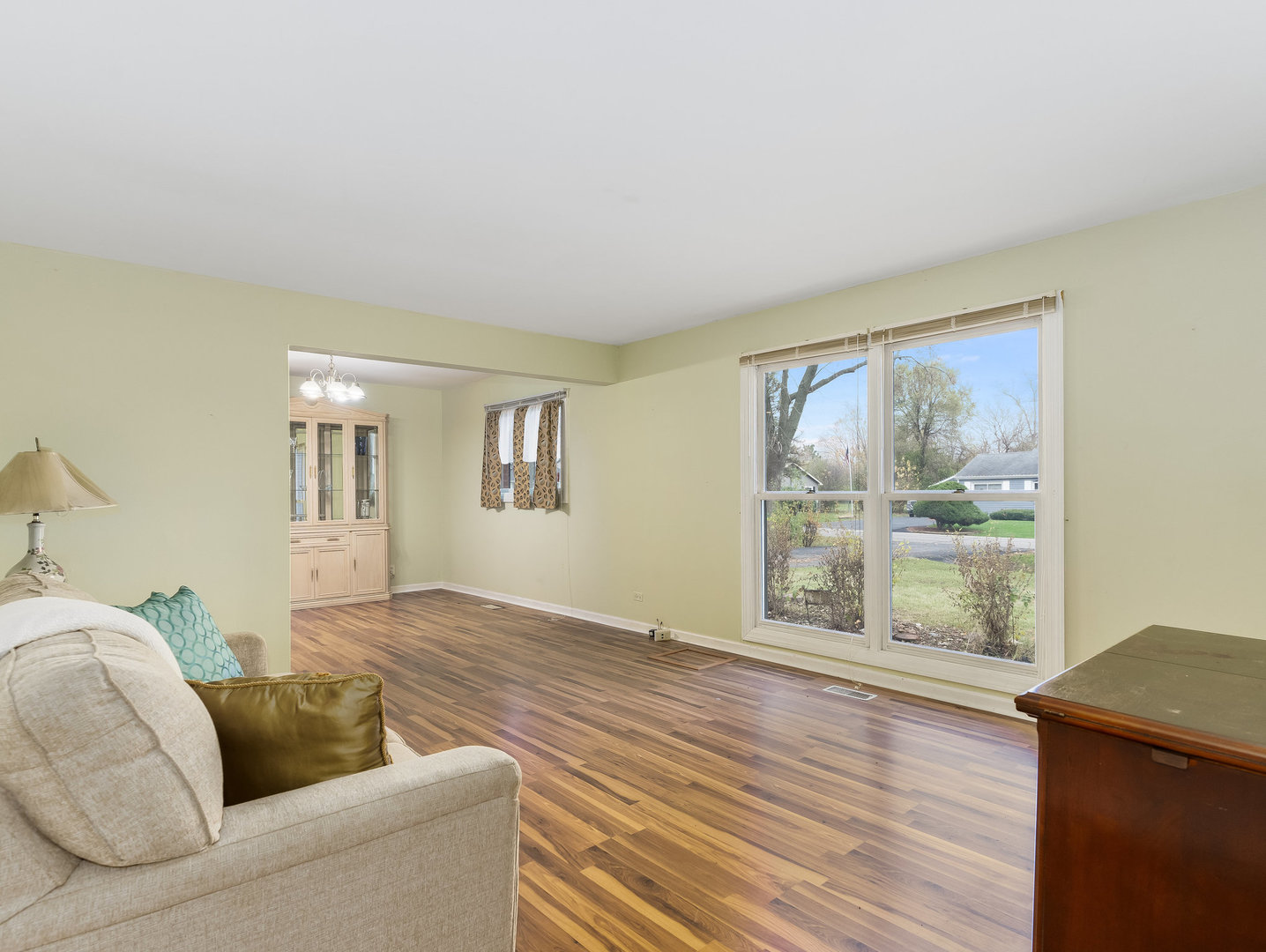 410 Aster Lane Hoffman Estates, IL 60169 - Photo 4 of 12 a living room with furniture and a window