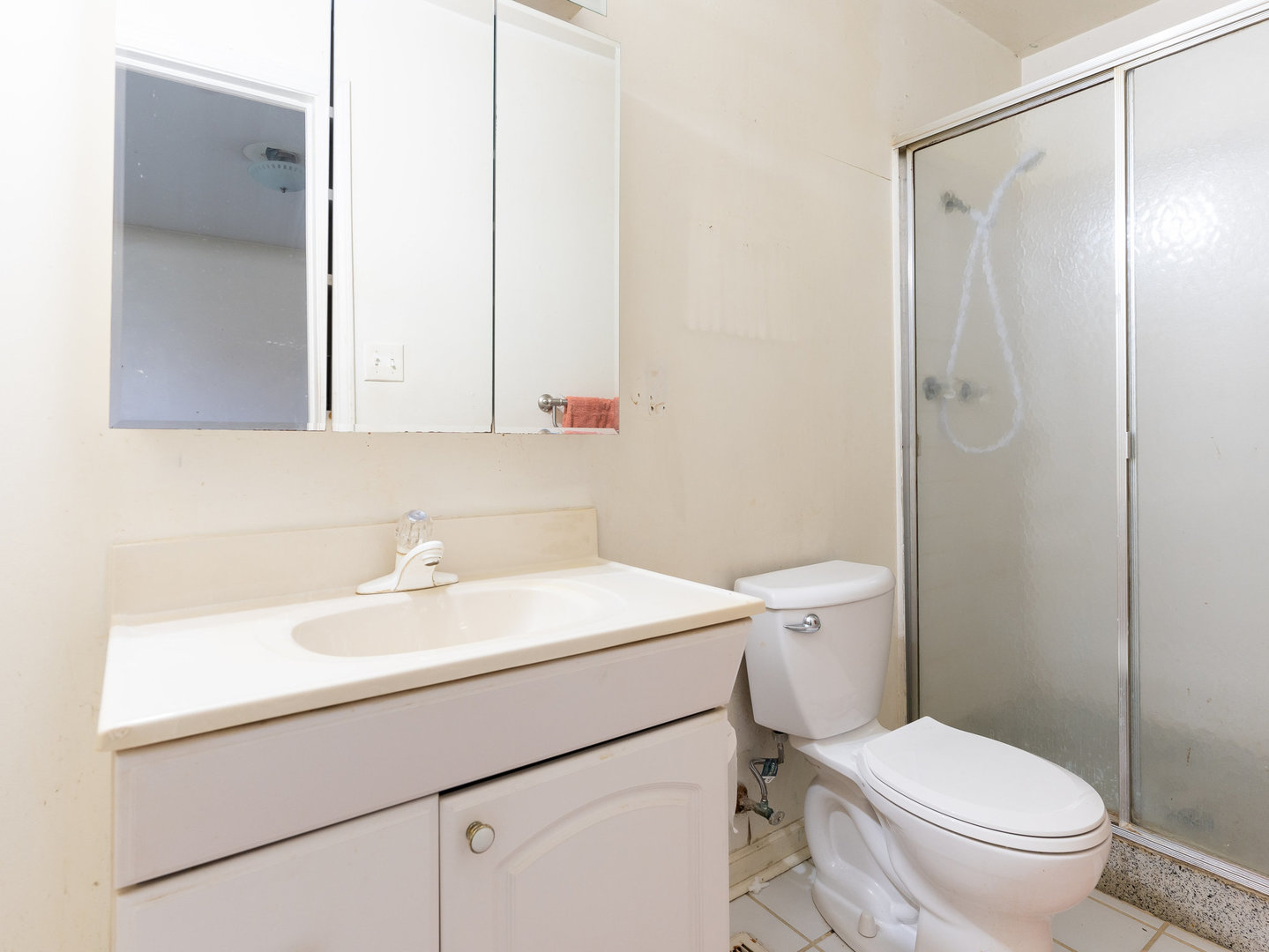 410 Aster Lane Hoffman Estates, IL 60169 - Photo 9 of 12 a bathroom with a sink a toilet and a mirror