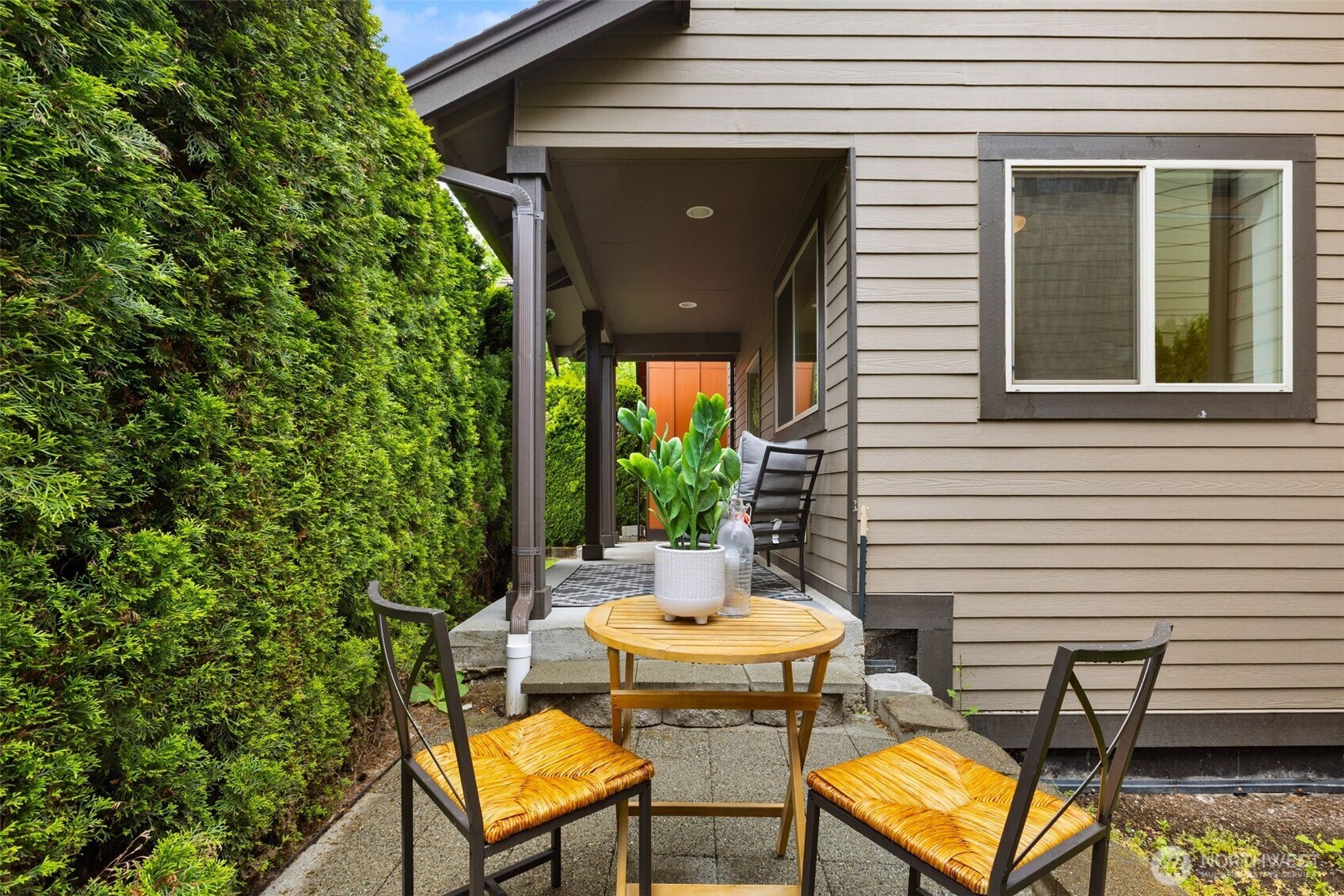 16516 2nd Park Southeast Bothell, WA 98012 - Photo 35 of 39 a view of a patio with table and chairs and potted plants with wooden floor