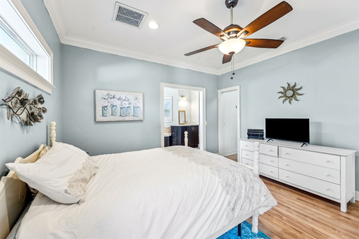 2513 Safe Harbor Lane Fernandina Beach, FL 32034 - Photo 23 of 54 a bedroom with a bed and a flat screen tv