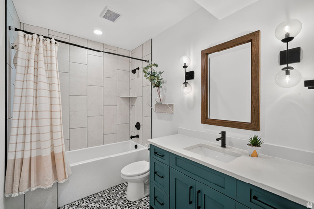 6536 West Muirfield Road Highland, UT 84003 - Photo 35 of 48 Bathroom featuring a teal double vanity with a white countertop and undermount sinks