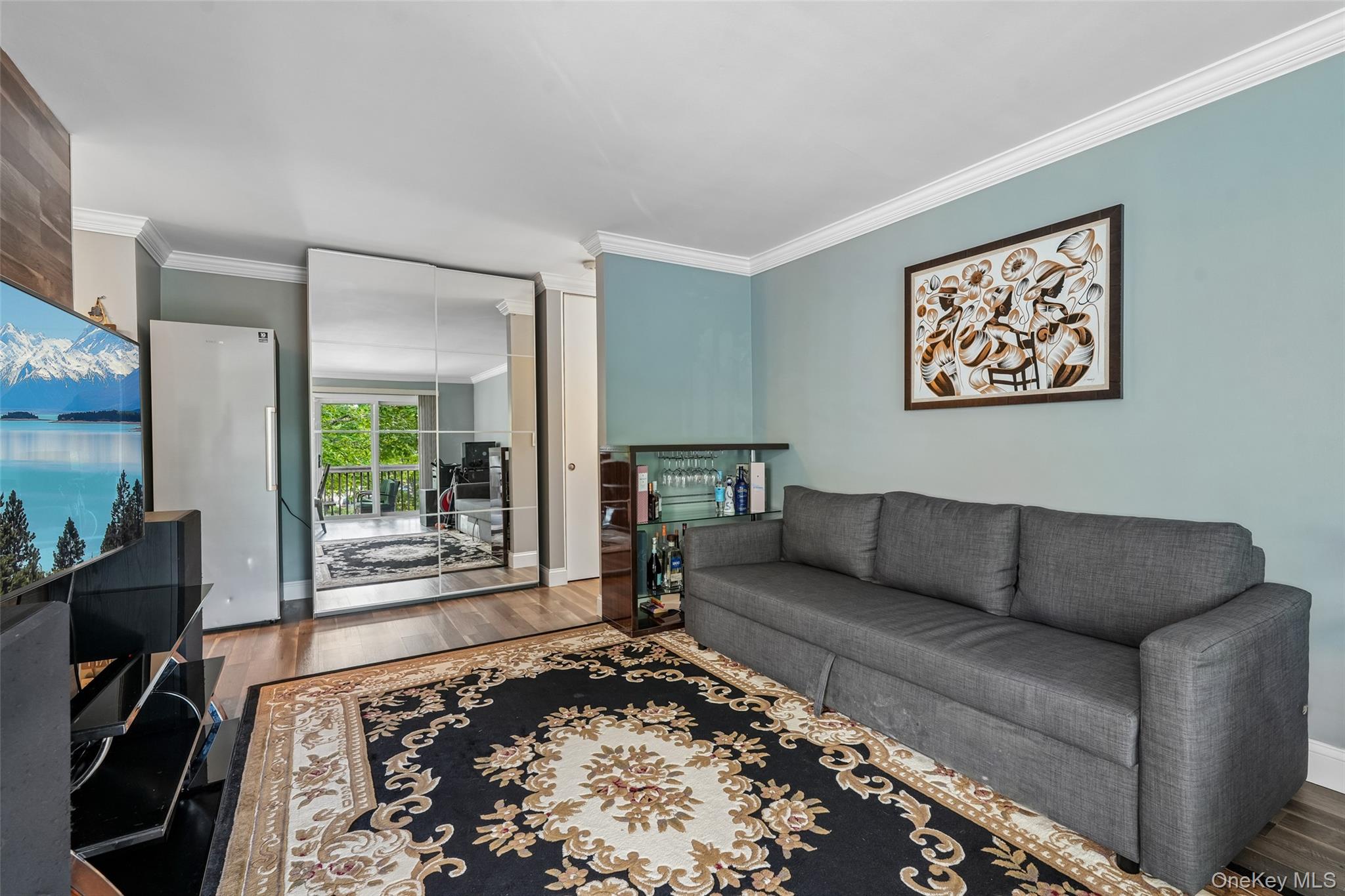 2 Secora Road, Unit C5 Monsey, NY 10952 - Photo 10 of 32 Wood-finish flooring with crown molding and light-colored walls