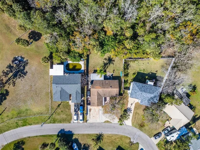 an aerial view of a houses with a city