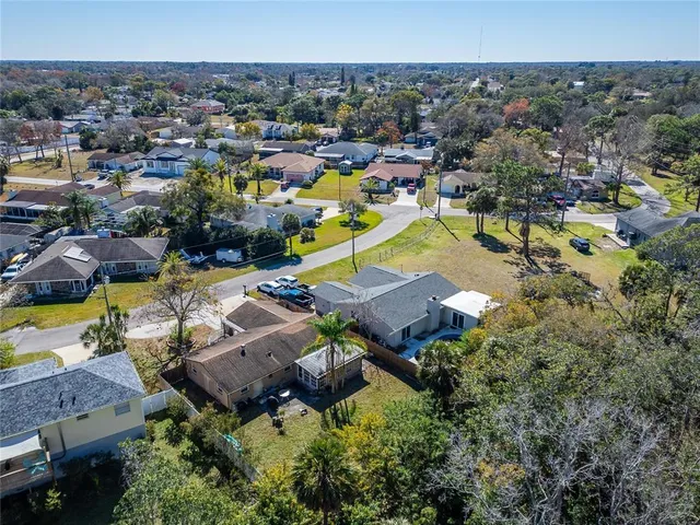 an aerial view of a house with a garden