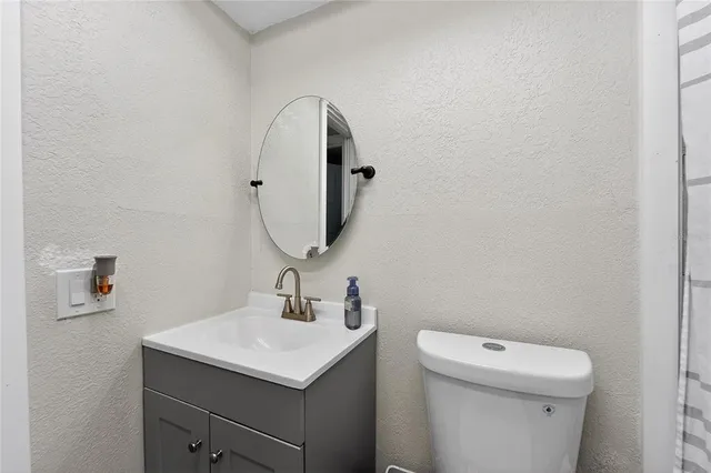 a living room with furniture and flowers