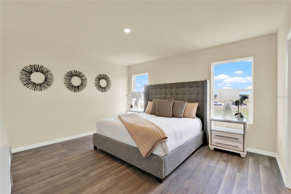 3517 Nettle Loop Tavares, FL 32778 - Photo 15 of 27 a bedroom with a bed and window