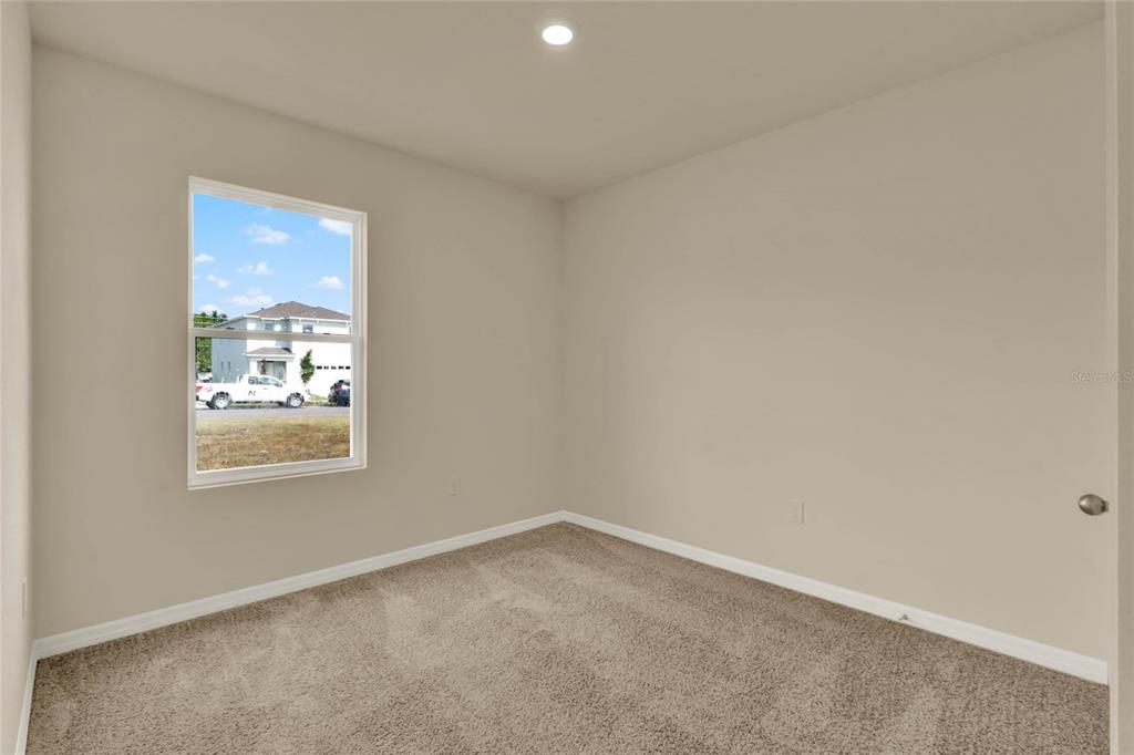 3517 Nettle Loop Tavares, FL 32778 - Photo 20 of 27 an empty room with windows