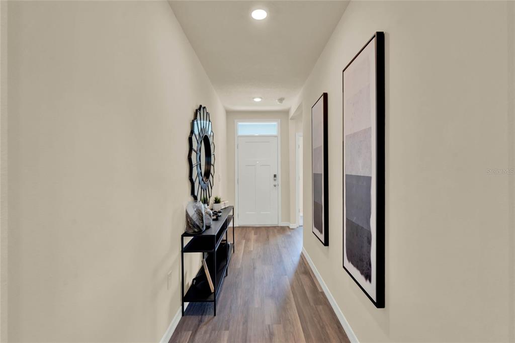 3517 Nettle Loop Tavares, FL 32778 - Photo 2 of 27 a view of a room with wooden floor and staircase