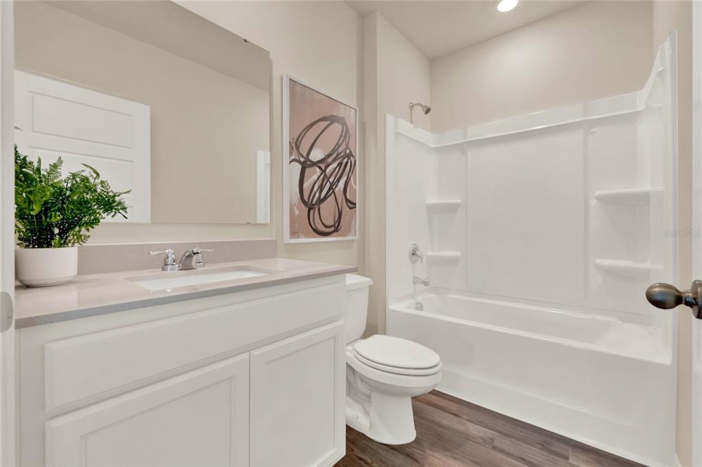3517 Nettle Loop Tavares, FL 32778 - Photo 21 of 27 a bathroom with a sink a toilet and shower