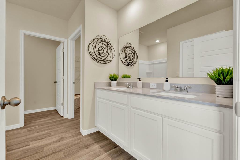3517 Nettle Loop Tavares, FL 32778 - Photo 22 of 27 a bathroom with a sink and a mirror