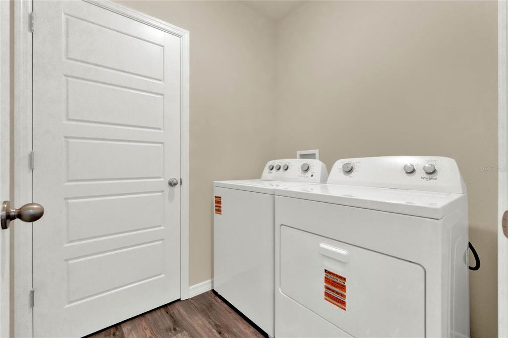 3517 Nettle Loop Tavares, FL 32778 - Photo 27 of 27 a utility room with dryer and washer