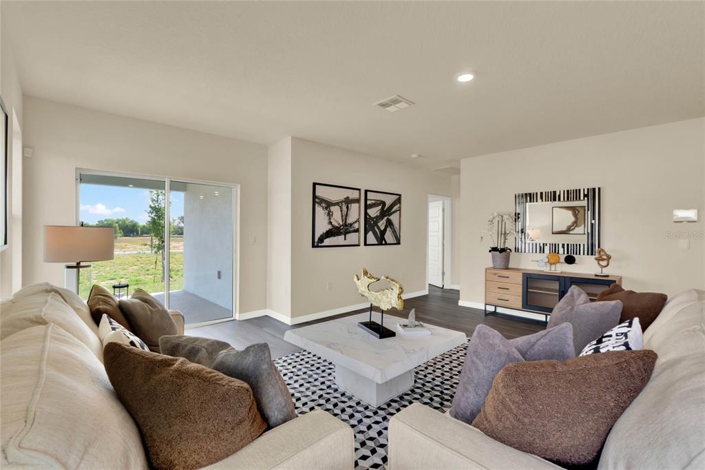 3517 Nettle Loop Tavares, FL 32778 - Photo 5 of 27 a living room with furniture and a wooden floor