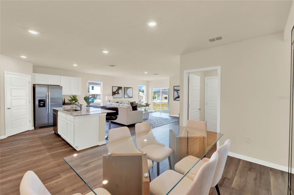 3517 Nettle Loop Tavares, FL 32778 - Photo 10 of 27 a living room with furniture and kitchen view