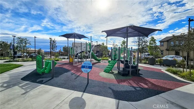 a view of a table and chairs under an umbrella