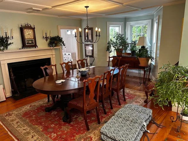 a view of a dining room with furniture and chandelier