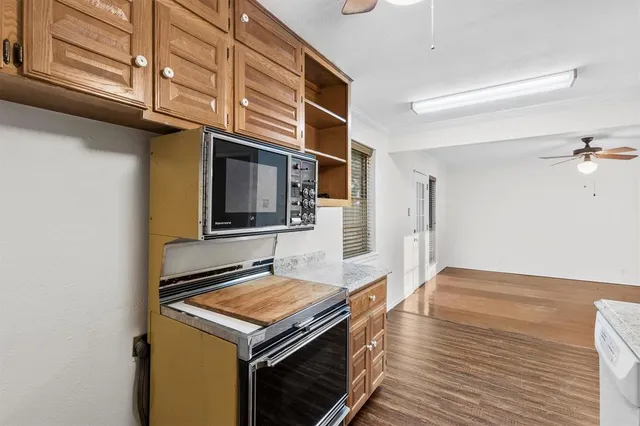 a kitchen with a stove and a microwave
