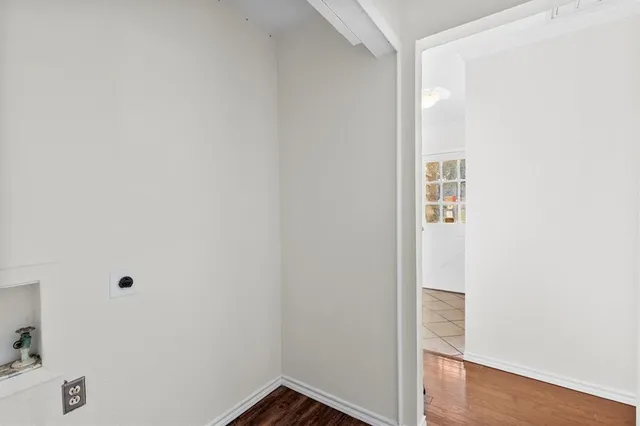 a view of a small space with wooden floor