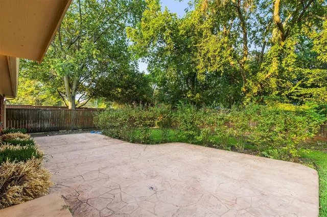 a view of backyard with green space