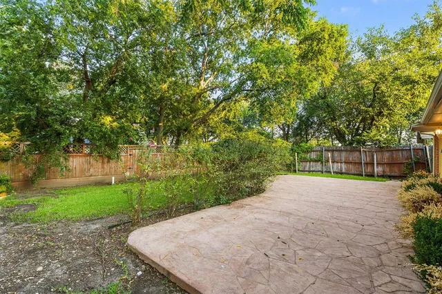 a view of backyard with green space