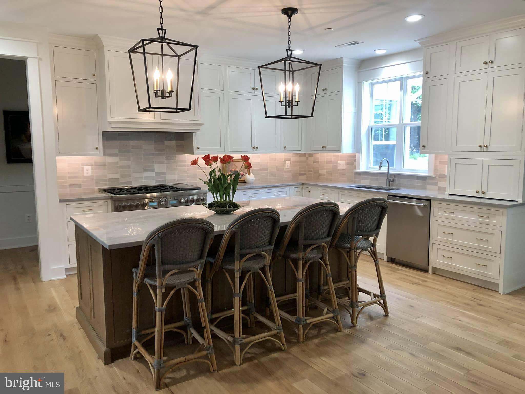 Mountain Church Road Middletown, MD 21769 - Photo 4 of 13 a kitchen with cabinets a sink dining table and chairs