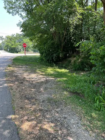 a view of outdoor space and green field