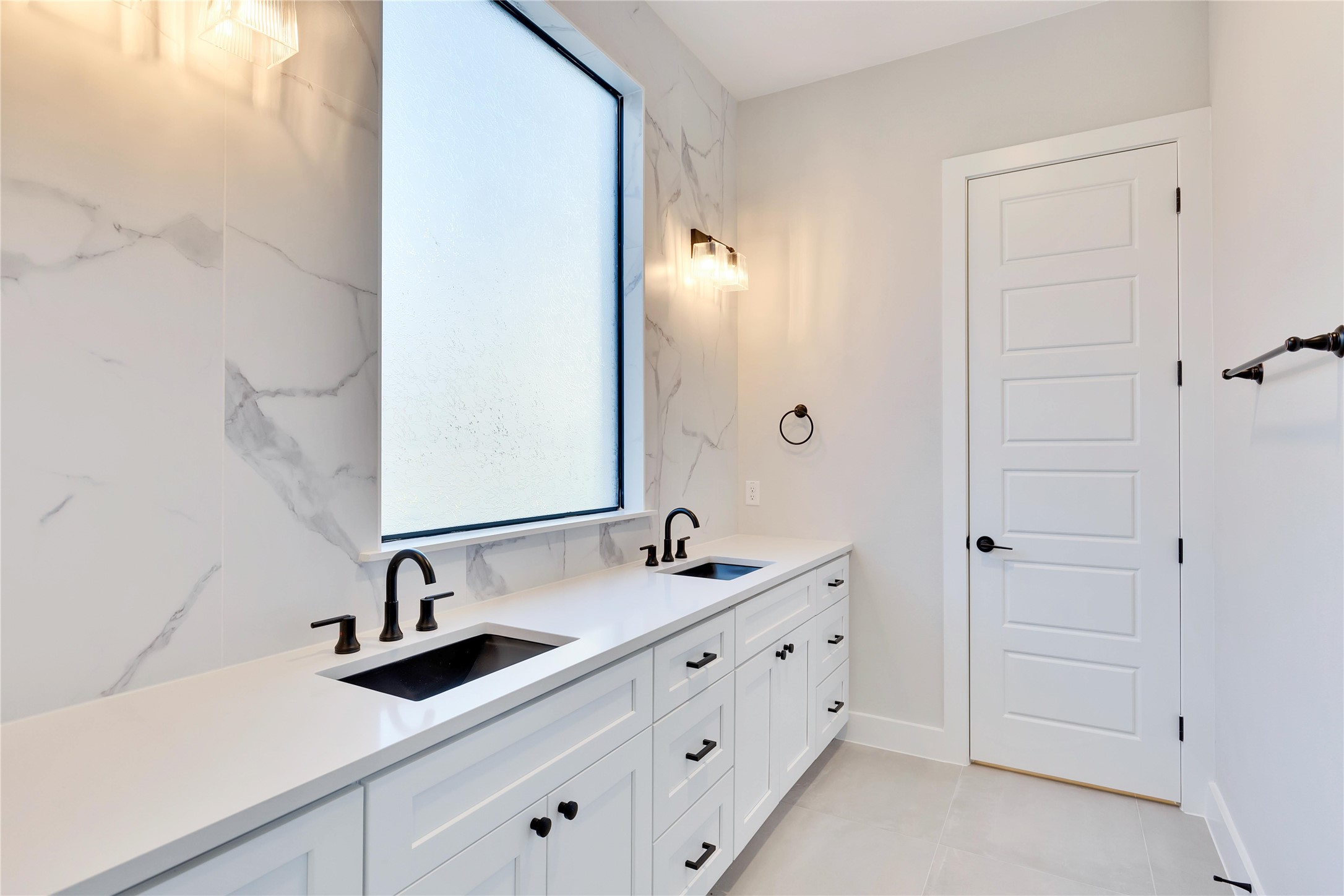 1304 Minnie Drive Austin, TX 78732 - Photo 16 of 28 Bathroom featuring double vanity and light tile patterned flooring