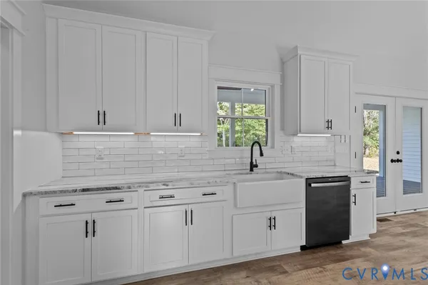 a kitchen with cabinets appliances and a counter