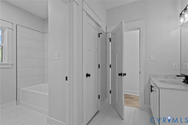 a bathroom with a bathtub and shower