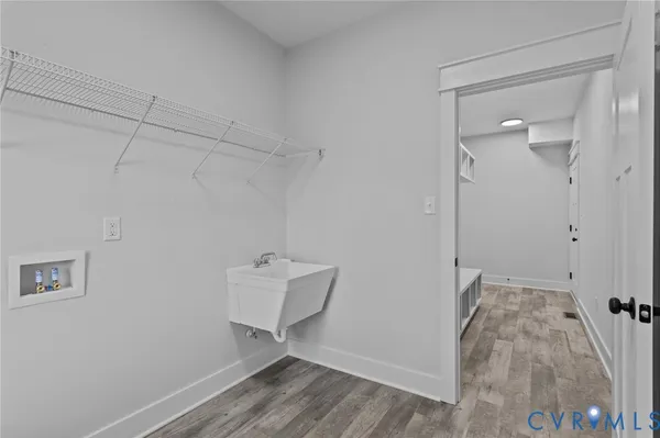 an empty room with a window and a ceiling fan