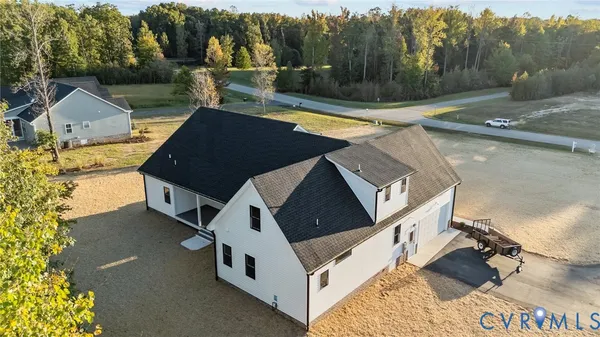 a view of a house with pool and a yard