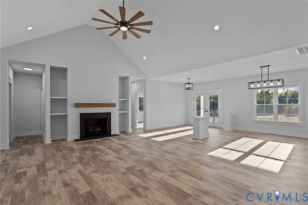 a kitchen with a stove a sink a refrigerator and cabinets