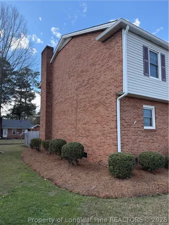 a brick building with a yard