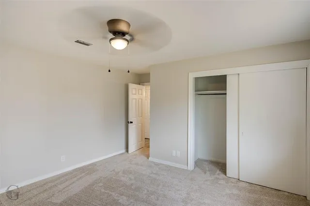 an empty room and window in a room