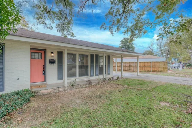 front view of a house with a garden