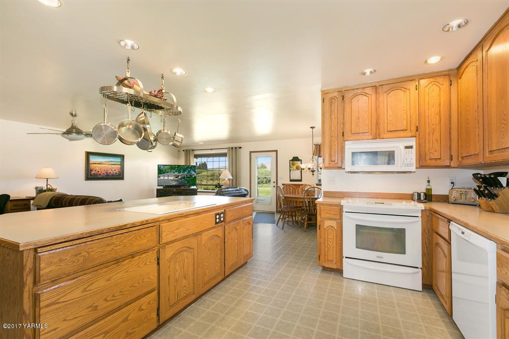 351 Sharp Road Tieton, WA 98947 - Photo 14 of 21 a kitchen with a stove sink and cabinets