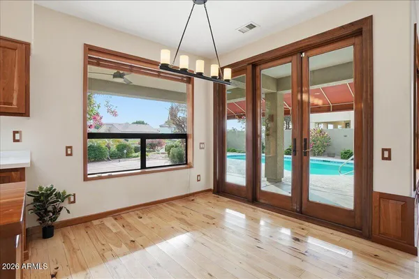 a room with lots of potted plants