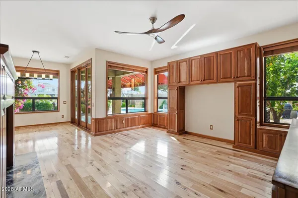 a view of a patio with a table and chairs