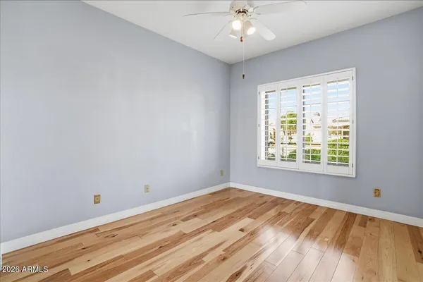 a view of a garden with a building in the background