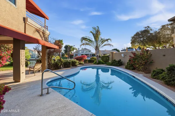 an aerial view of a house with yard swimming pool and outdoor seating