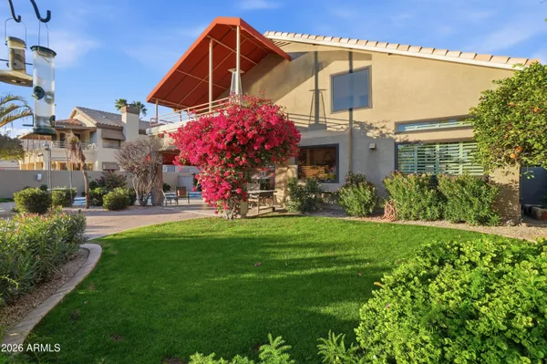 an aerial view of a house with a lake view