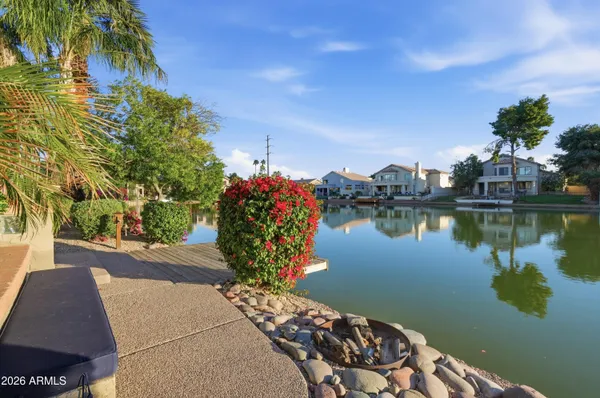 a big room with wooden floor and windows