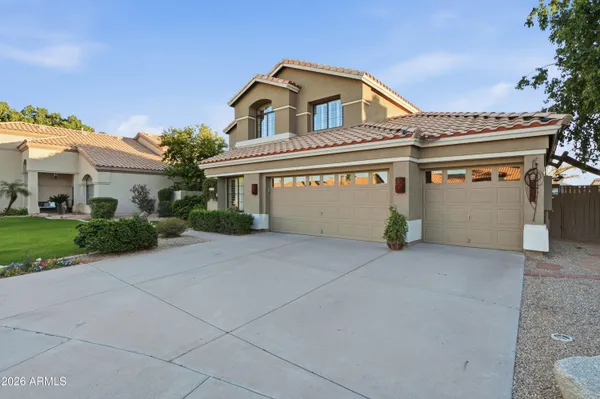 a view of a chairs and table in a patio