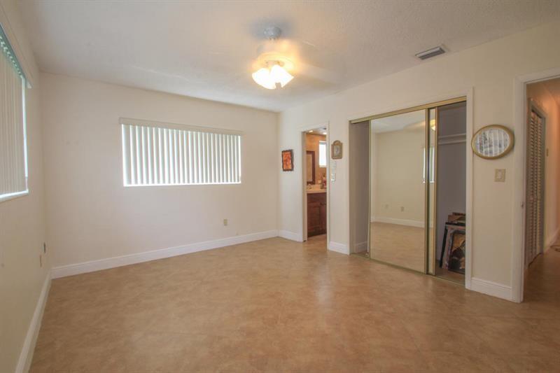 98 Seminole Lane Boca Raton, FL 33487 - Photo 8 of 42 a view of an empty room with window and closet area