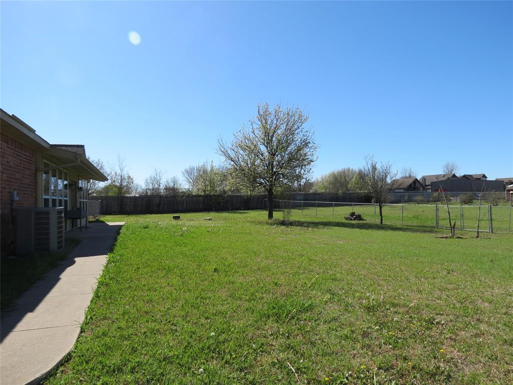 109 Country View Lane Fate, TX 75189 - Photo 16 of 24 a view of a field of grass and trees