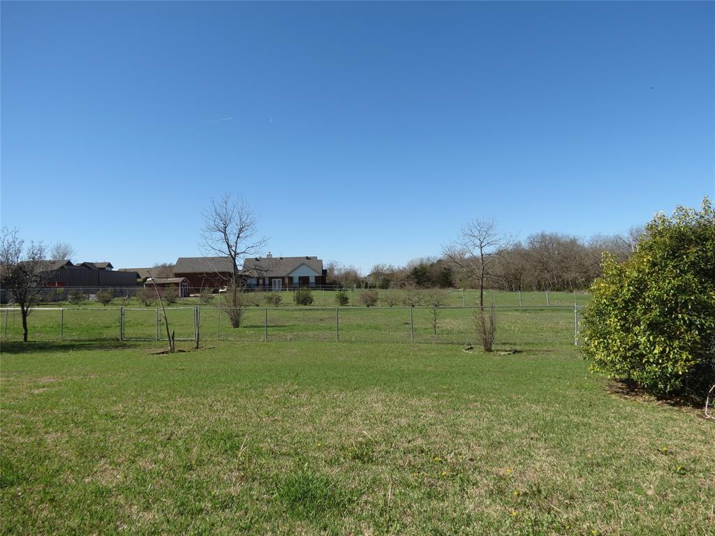 109 Country View Lane Fate, TX 75189 - Photo 17 of 24 a green field with lots of trees in it