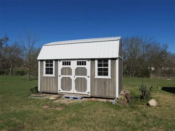 a house view with a backyard space