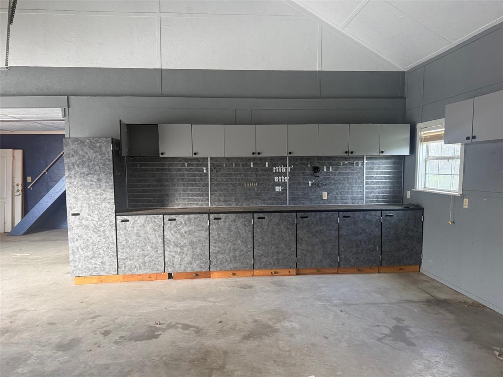 109 Country View Lane Fate, TX 75189 - Photo 22 of 24 a view of a garage with furniture