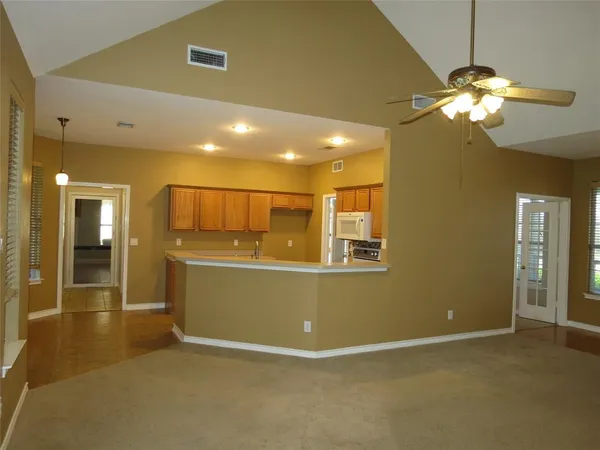 a view of livingroom and kitchen with furniture